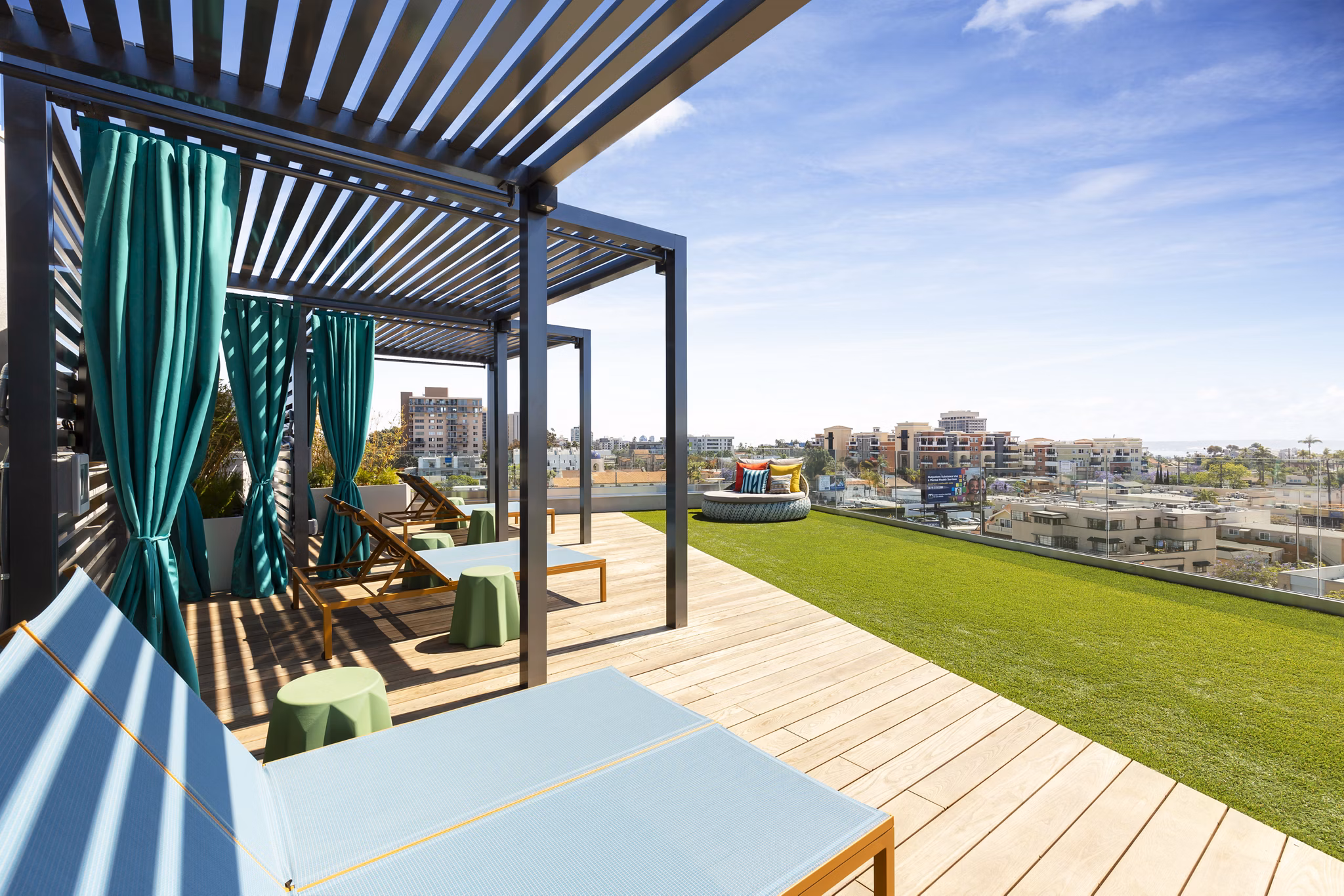 Expansive rooftop deck with city skyline views at Mode Apartments