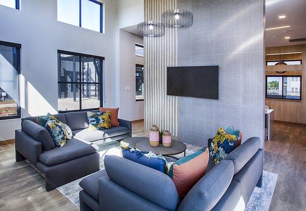 Modern clubhouse/lobby with elegant seating at Ascend at Prairie Village Apartments, ideal for social gatherings and relaxation