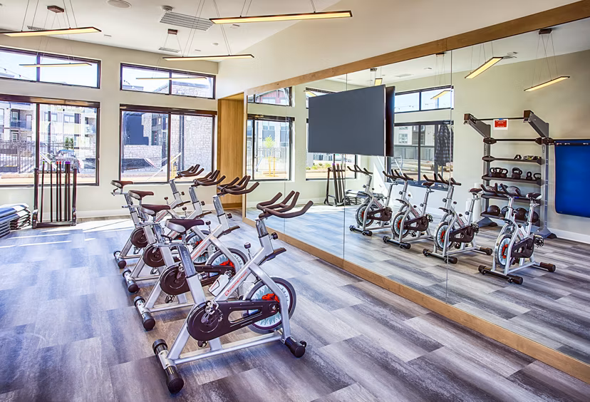 Yoga/spin studio with modern equipment at Ascend at Prairie Village Apartments