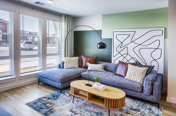 Spacious living room with modern furnishings in Ascend at Prairie Village Apartments