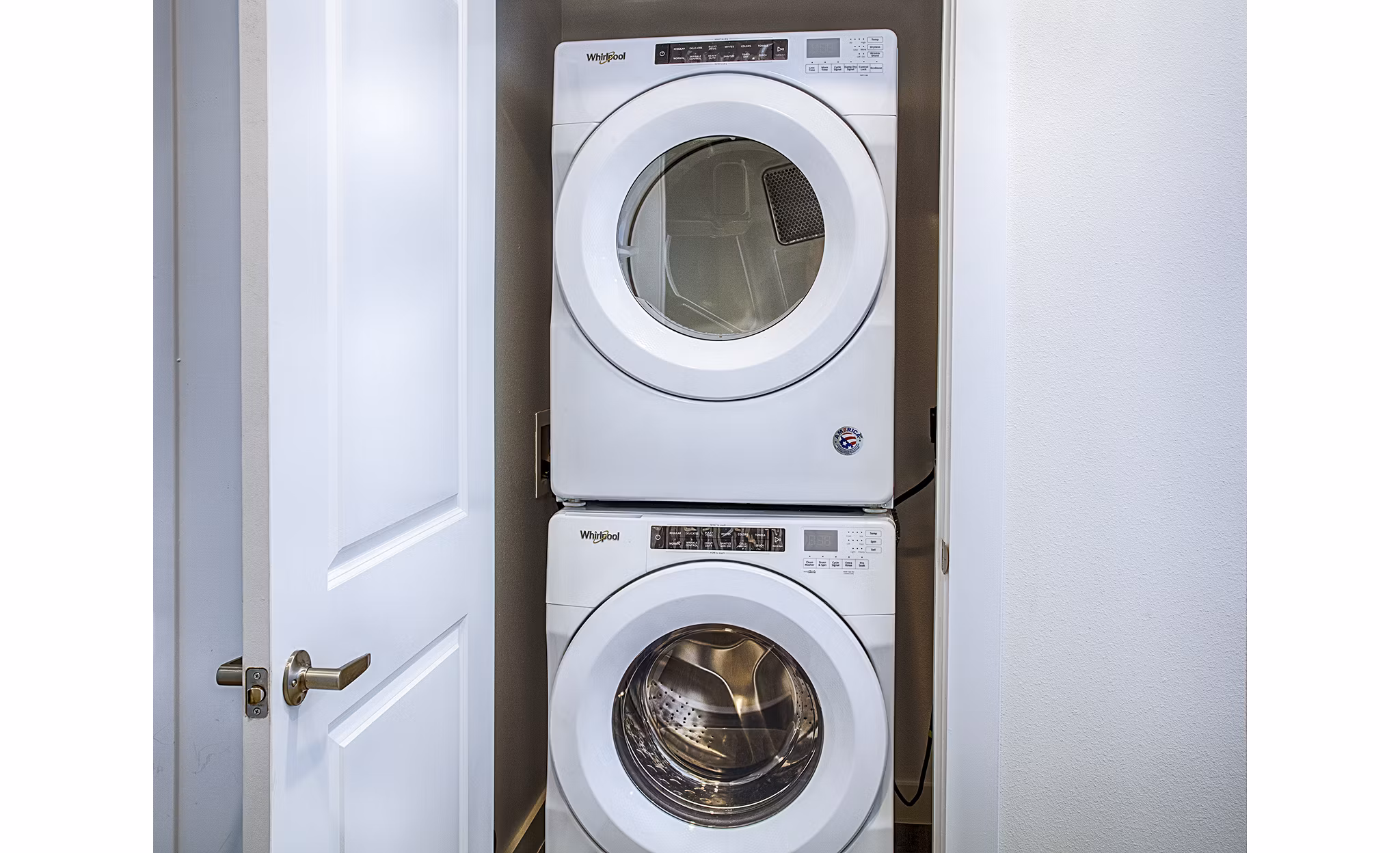Laundry room with modern washers and dryers at Ascend at Prairie Village Apartments