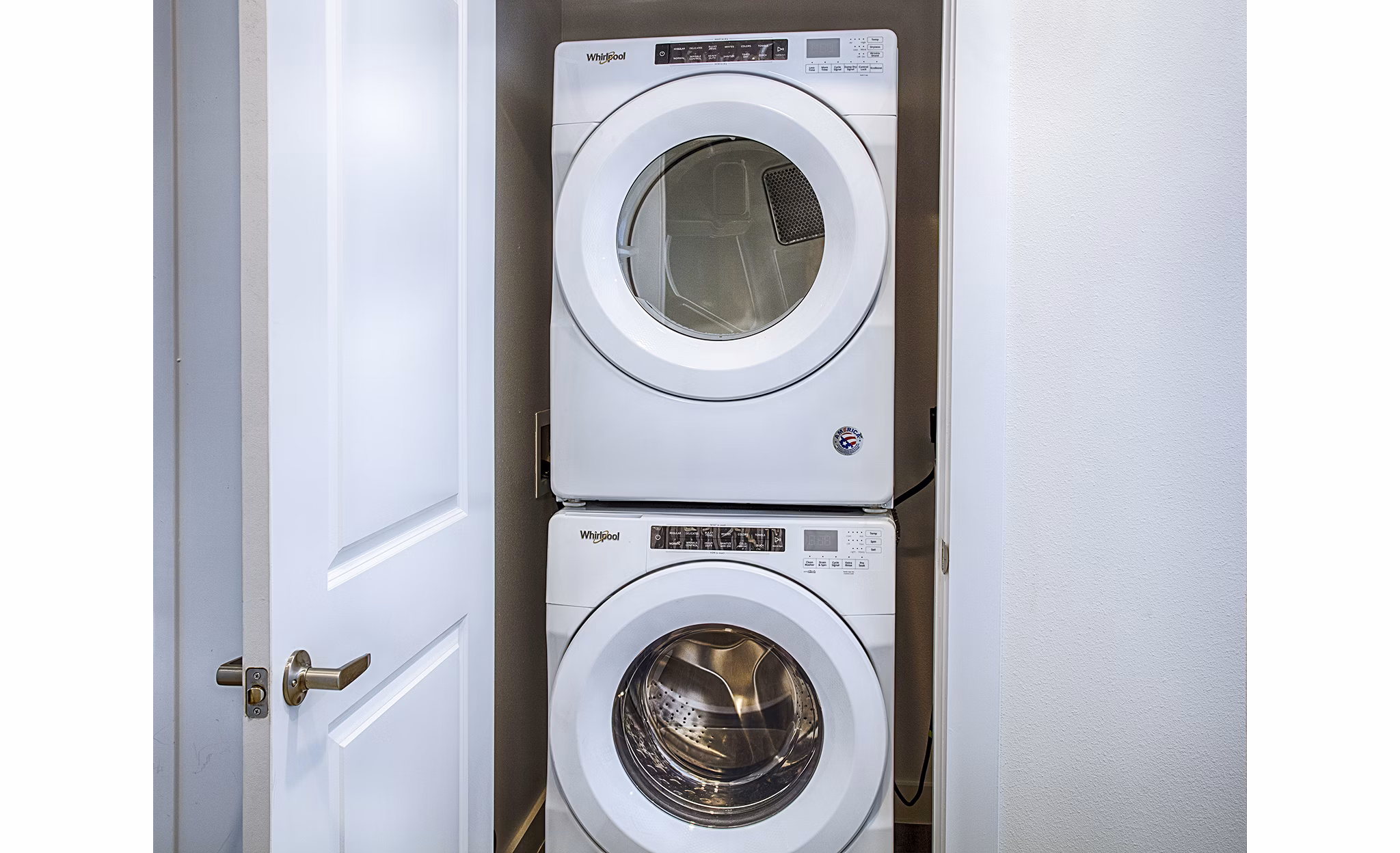Laundry room with modern washers and dryers at Ascend at Prairie Village Apartments