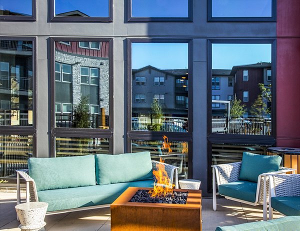 Cozy fire pit at Ascend at Prairie Village Apartments, ideal for outdoor gatherings in a luxurious setting