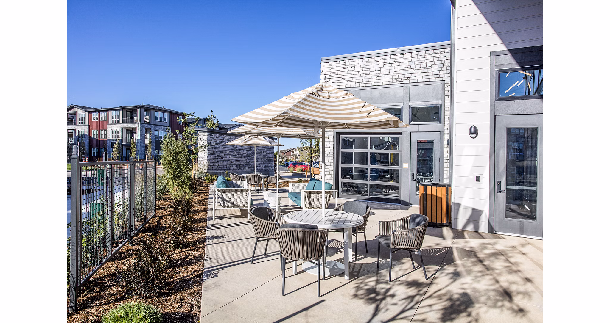 Ascend at Prairie Village Apartments: Cozy patio with seating and greenery, creating a relaxing outdoor space