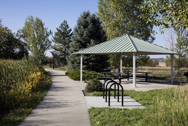 Courtyard at Ascend Prairie Village Apartments featuring lush landscaping and seating areas