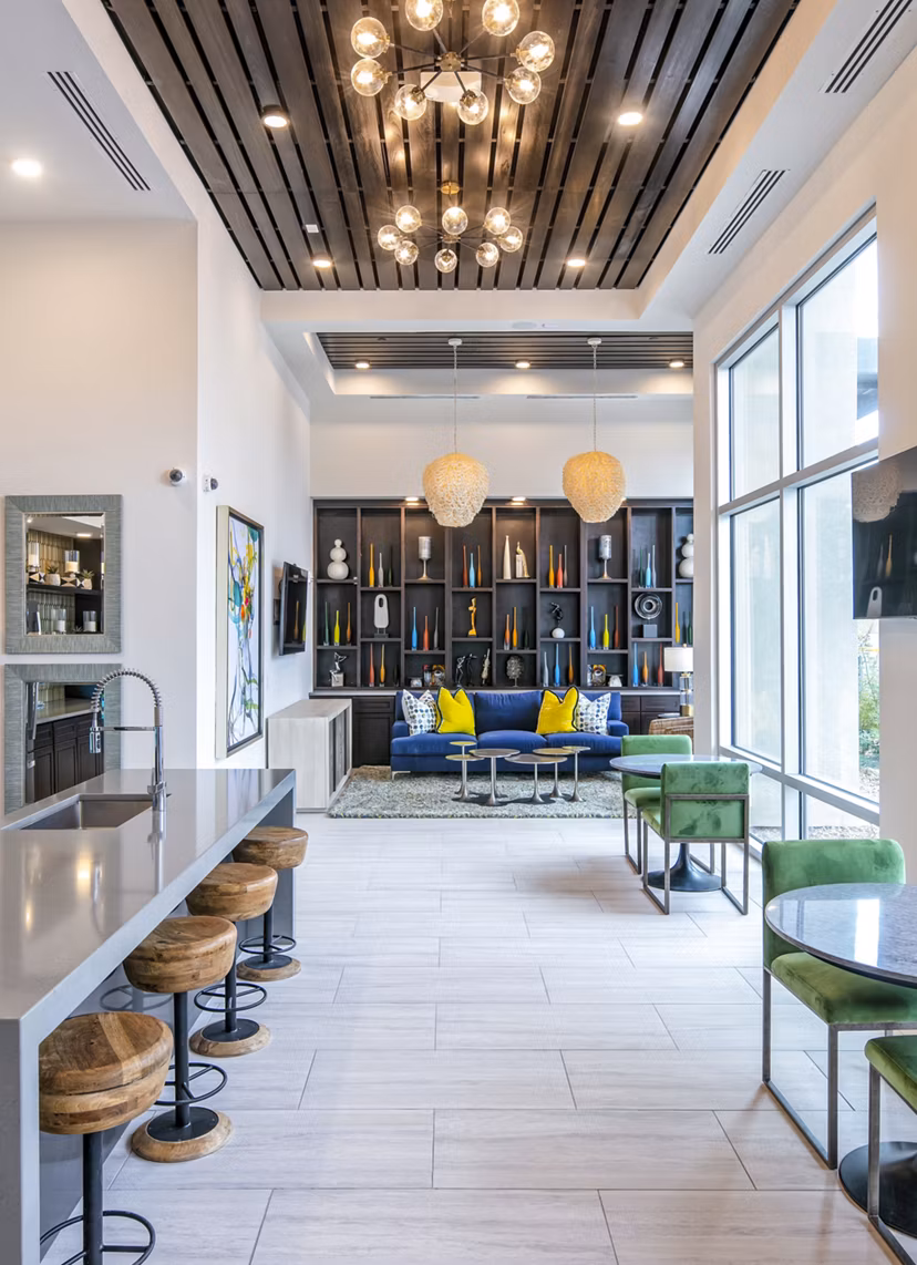 Stylish interior space with seating area and large windows in luxury apartments