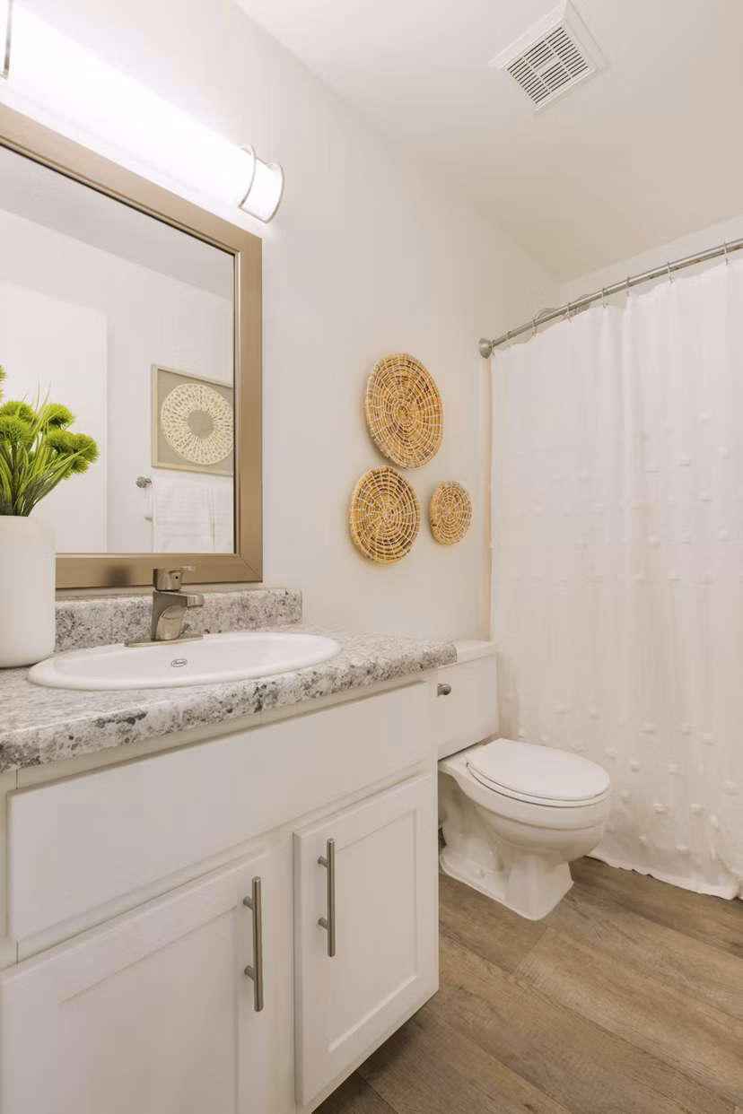 Bathroom with sleek fixtures and modern design at The Joshua Apartments, offering luxurious living spaces in Greystar's upscale community