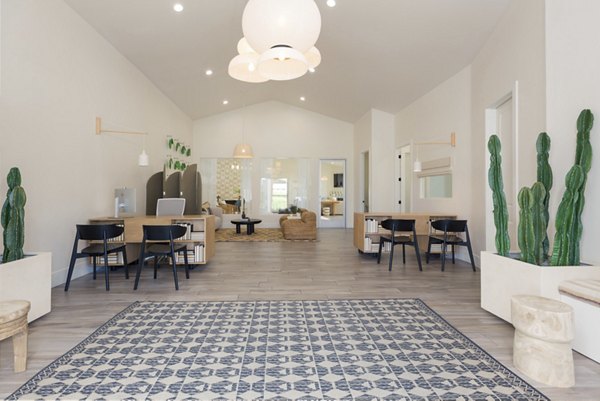 Contemporary clubhouse featuring lounge seating at The Joshua Apartments luxury community
