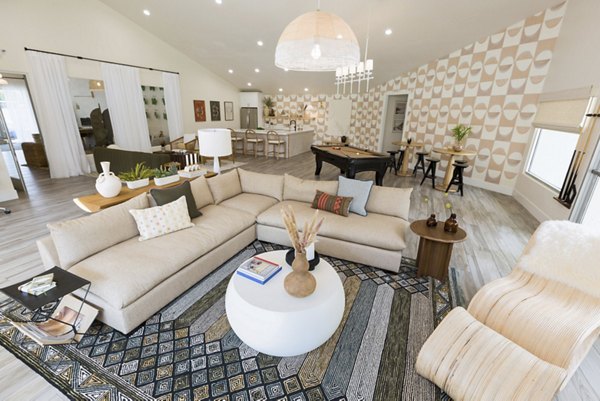 Modern clubhouse with cozy seating areas at The Joshua Apartments luxury community