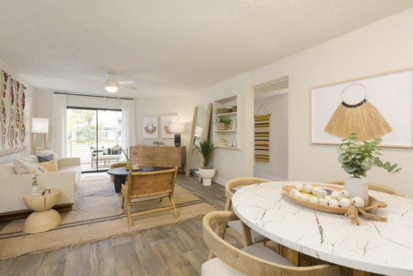 Dining area featuring elegant lighting and modern furnishings at The Joshua Apartments in Greystar luxury community