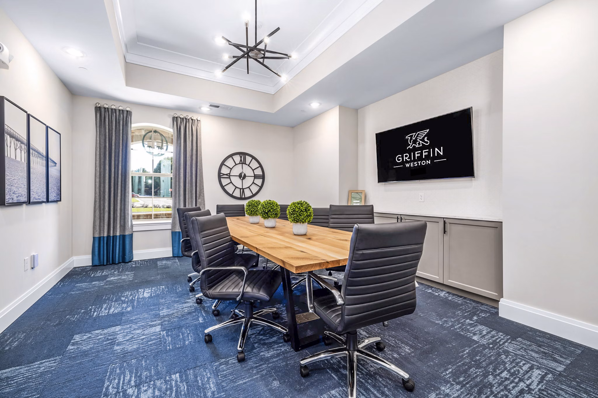 Clubhouse meeting facility with modern decor at Griffin Weston Apartments, perfect for gatherings and business meetings