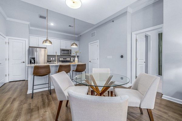 Elegant dining room with modern decor at Griffin Weston Apartments, featuring luxury finishes and ample natural light