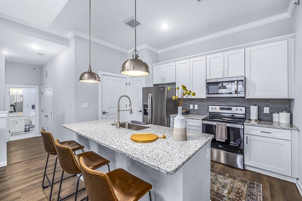 Modern kitchen with stainless steel appliances at Griffin Weston Apartments, Greystar luxury community