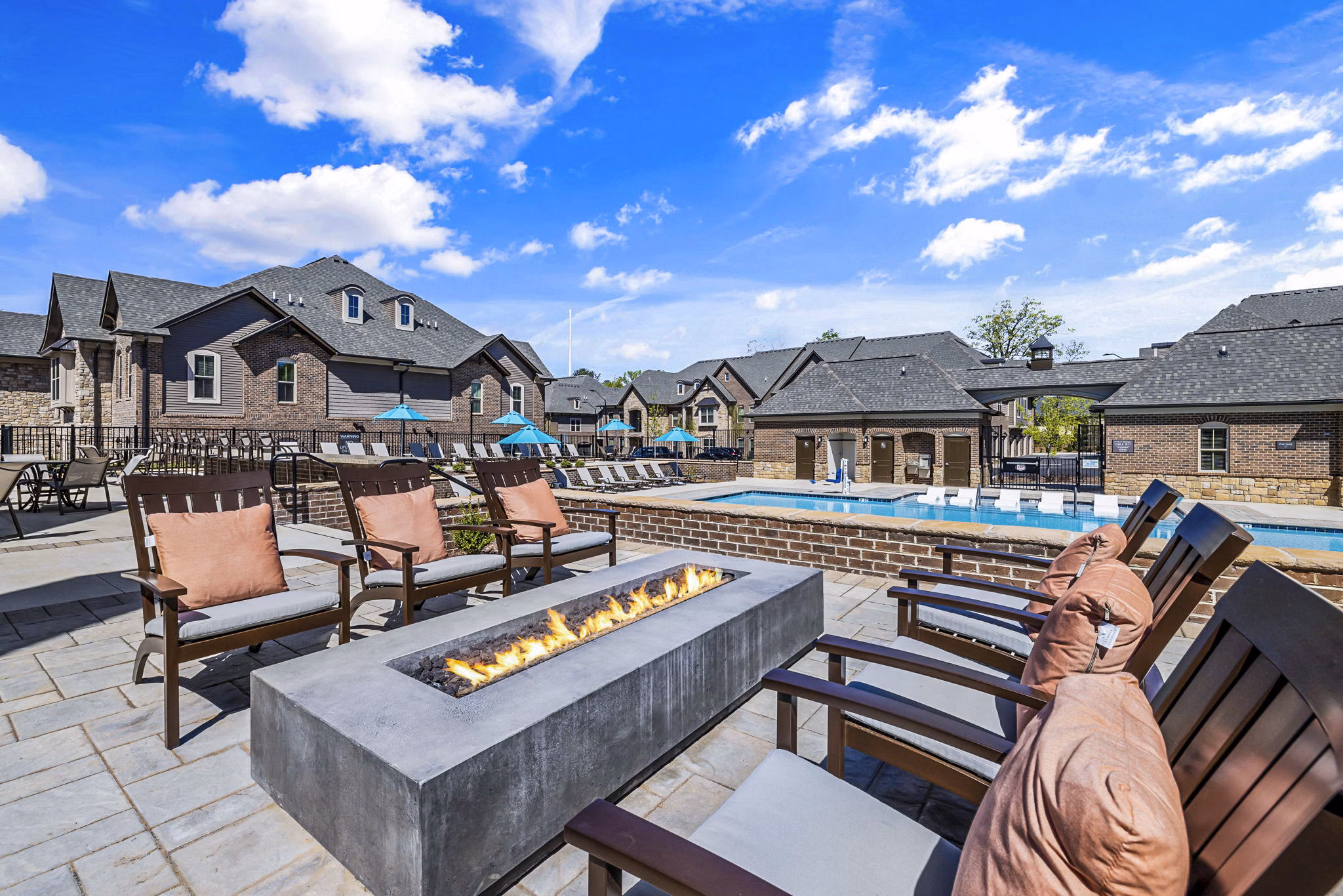 Fire pit and cozy patio seating at Griffin Weston Apartments, a luxury community by Greystar