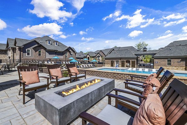 Fire pit and cozy patio seating at Griffin Weston Apartments, a luxury community by Greystar