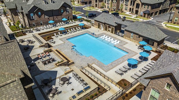 Resort-style pool with lounge chairs at Griffin Weston Apartments, ideal for relaxation and socializing in a luxurious setting