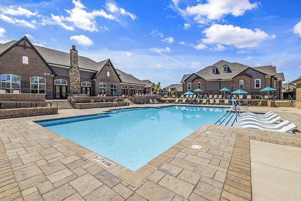 Luxurious pool at Griffin Weston Apartments with lounge chairs and scenic views, perfect for relaxation at Greystar's premier property