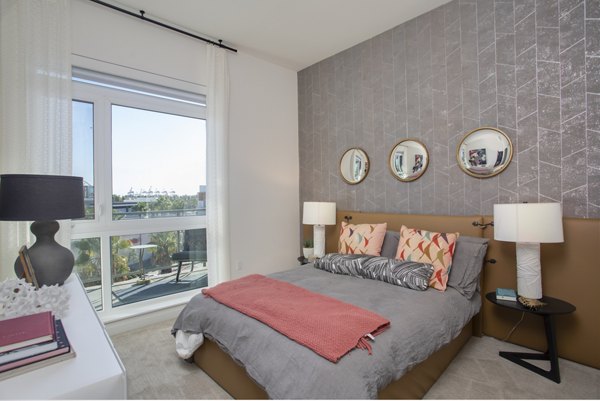 Cozy bedroom with ocean views at Oceanaire Apartments