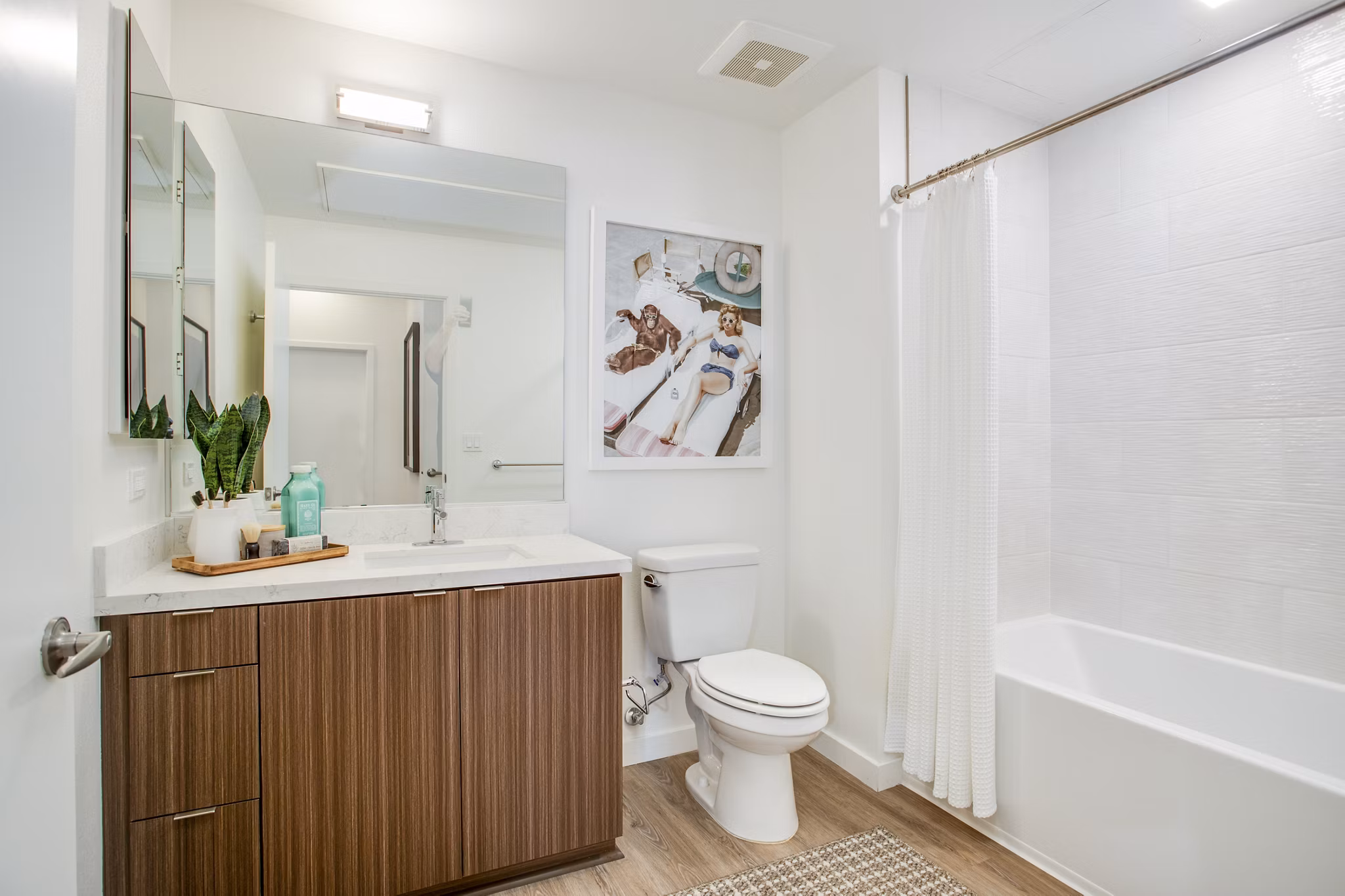 Oceanaire Apartments: Modern bathroom with sleek fixtures and marble countertops in luxury beachfront living