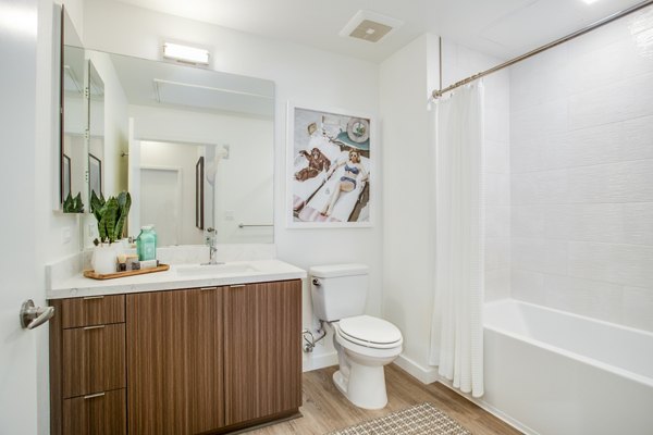 Oceanaire Apartments: Modern bathroom with sleek fixtures and marble countertops in luxury beachfront living