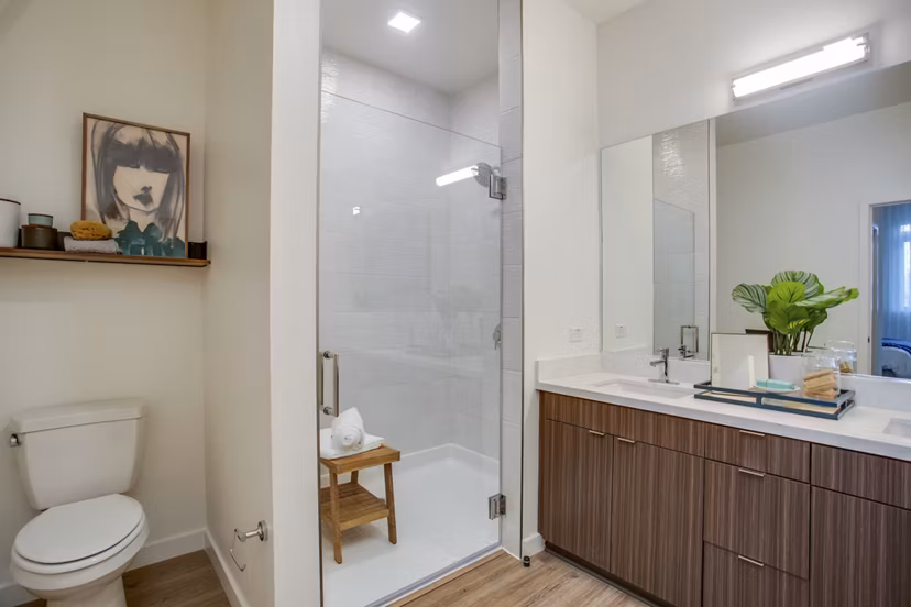 Modern bathroom with sleek fixtures and large vanity at Oceanaire Apartments, luxury property by the coast