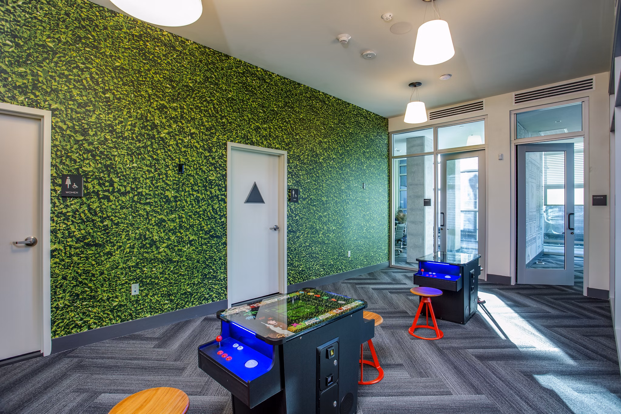 Game room with billiards table and seating area at Oceanaire Apartments, perfect for socializing and entertainment in a luxury setting