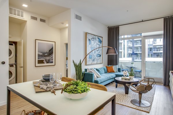 Dining area with modern furnishings and ocean views at Oceanaire Apartments