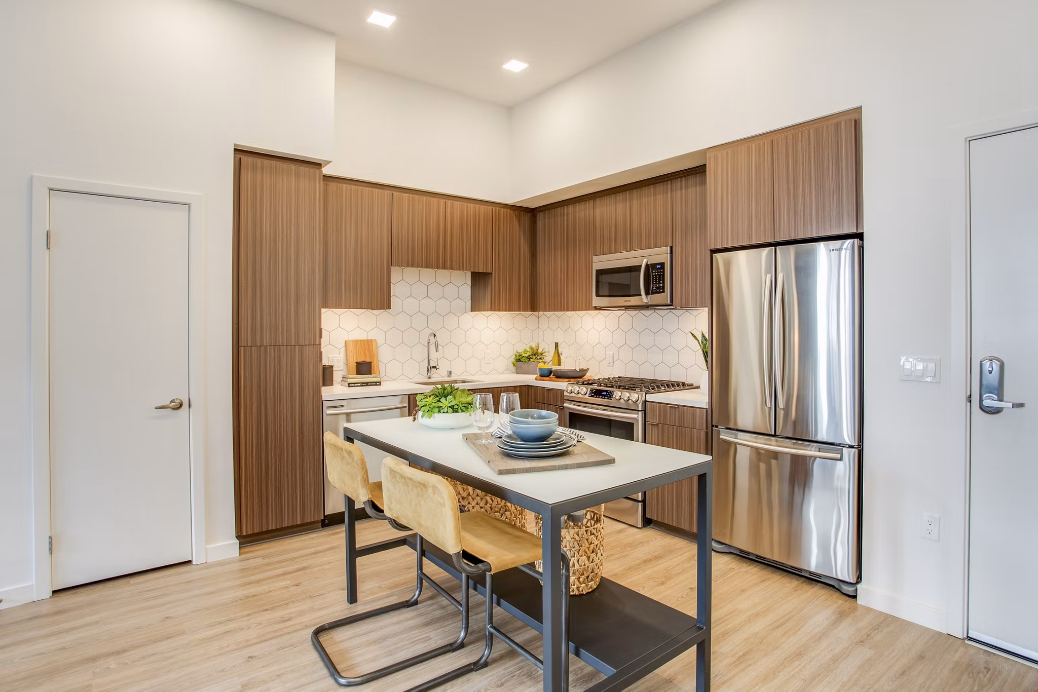 Contemporary kitchen with stainless steel appliances at Oceanaire Apartments