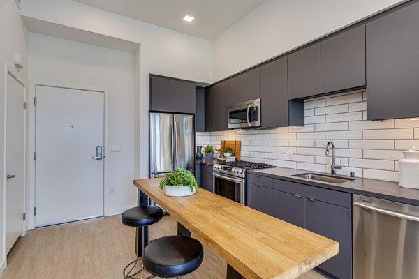 Oceanaire Apartments: Modern kitchen with stainless steel appliances and ample counter space