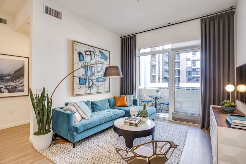 Spacious living room with ocean views and modern decor in Oceanaire Apartments, featuring luxury amenities