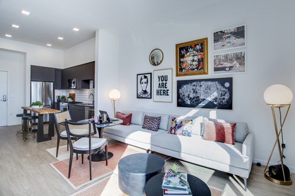 Modern living room with ocean views at Oceanaire Apartments, featuring elegant decor and natural lighting