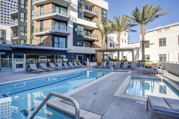 Resort-style pool area with lush landscaping at Oceanaire Apartments, offering luxury living near the beach