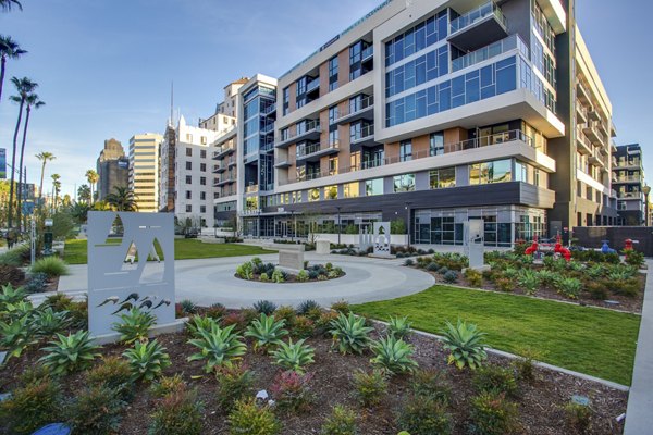 Oceanaire Apartments: Serene courtyard with lush landscaping and seating areas designed for relaxation and leisure in a modern luxury setting