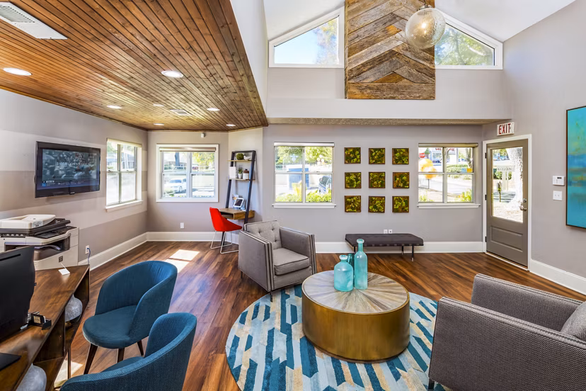 Spacious clubhouse lobby with modern seating and decor at Trellis Apartments