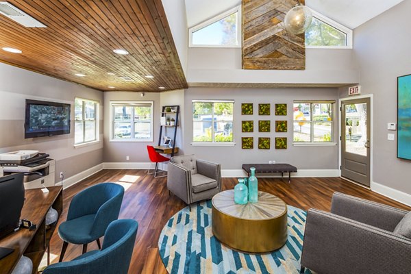 Spacious clubhouse lobby with modern seating and decor at Trellis Apartments