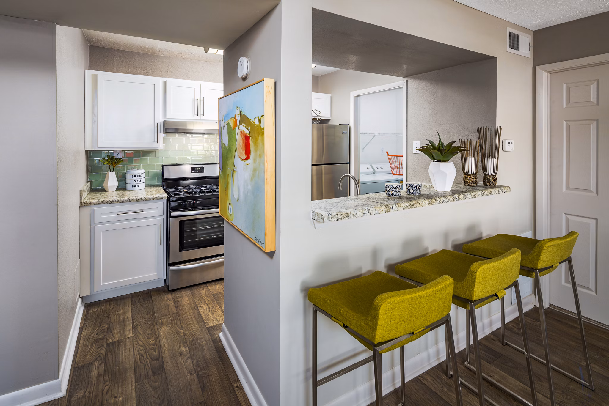 Kitchen featuring modern appliances and sleek countertops at Trellis Apartments luxury homes