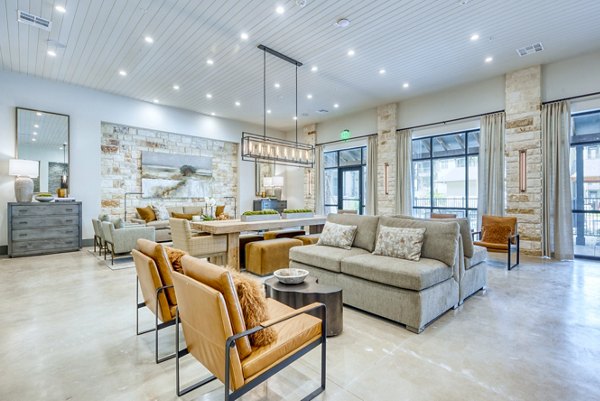 Clubhouse with modern furnishings and open-concept design at Citadel at Lookout Apartments, perfect for hosting events and gatherings