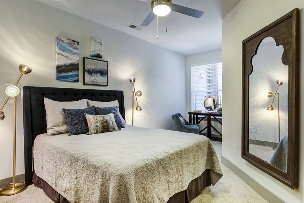 Elegant bedroom with modern furnishings at Verde at McCullough Station Apartments