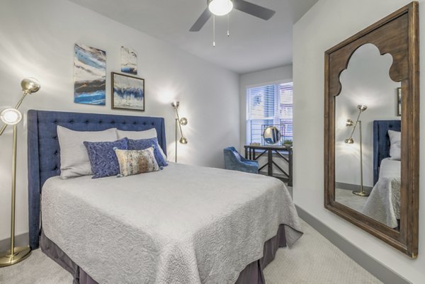 Modern bedroom with stylish furnishings at Verde at McCullough Station Apartments