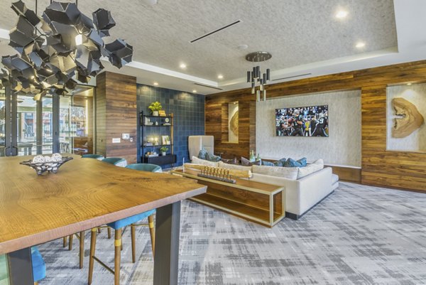 Clubhouse featuring modern design and comfortable seating at Verde at McCullough Station Apartments