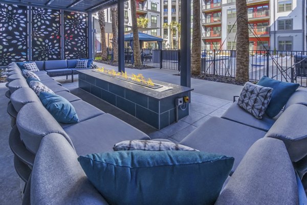 Cozy fire pit area at Verde at McCullough Station Apartments perfect for outdoor gatherings and relaxation