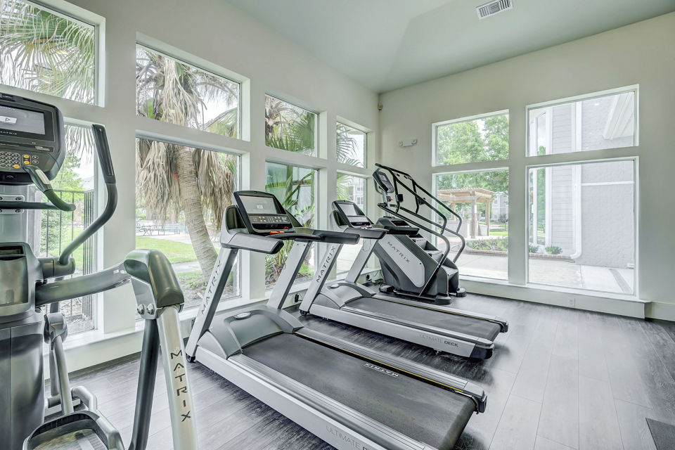 Fitness center with modern equipment at Blu on the Boulevard Apartments