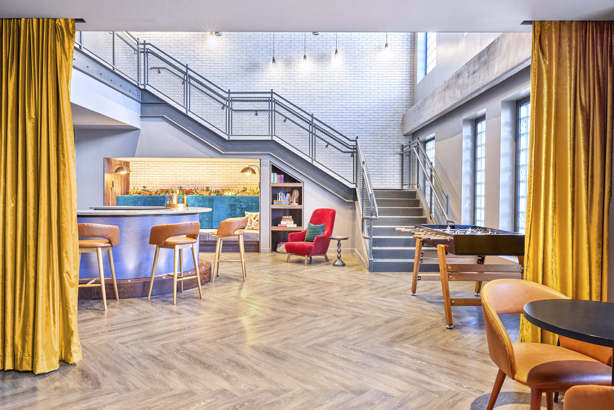 Clubhouse with modern design and seating areas at Miscela Apartments
