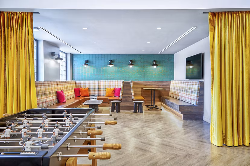 Elegant clubhouse featuring modern seating and decor at Miscela Apartments in vibrant new community
