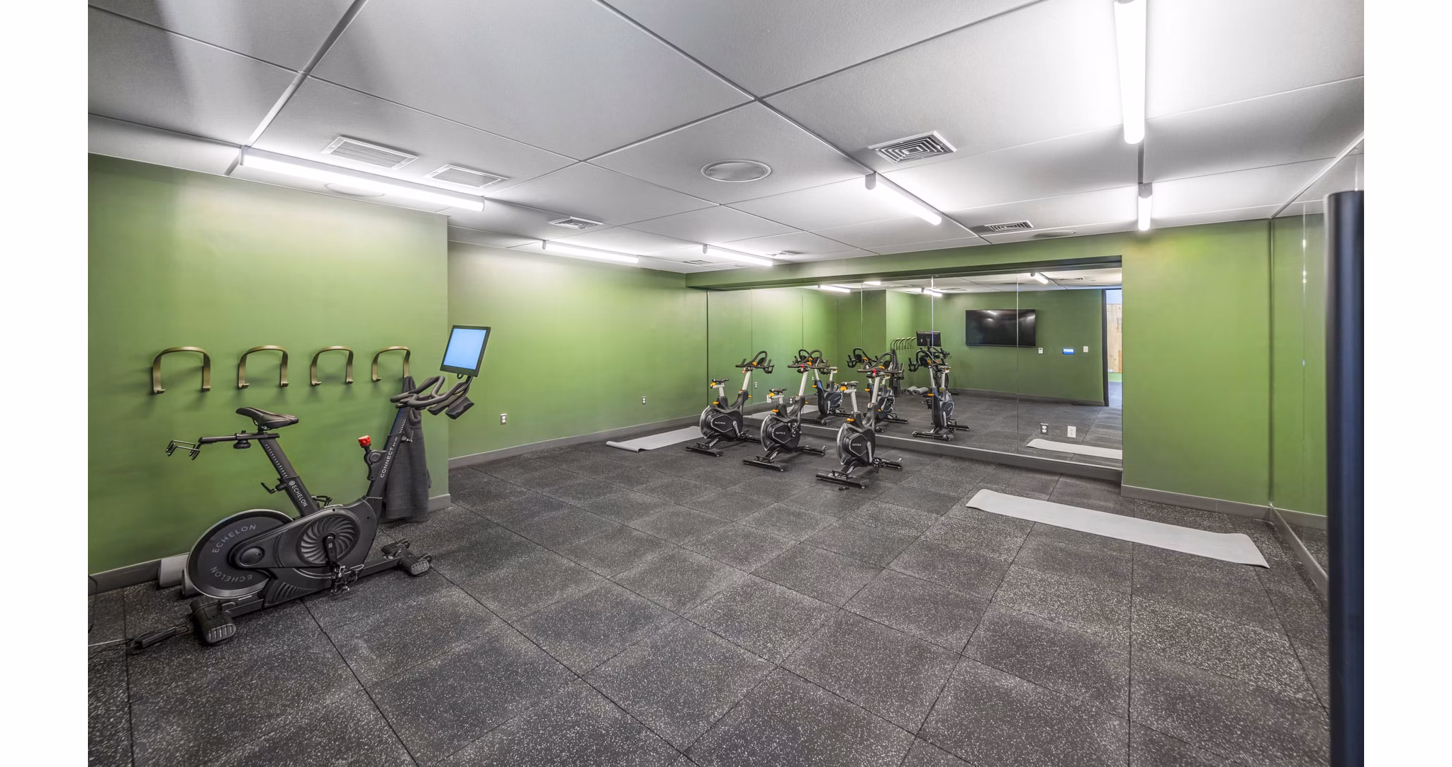 State-of-the-art spin studio at Miscela Apartments: Engage in energizing fitness sessions at this premier fitness center