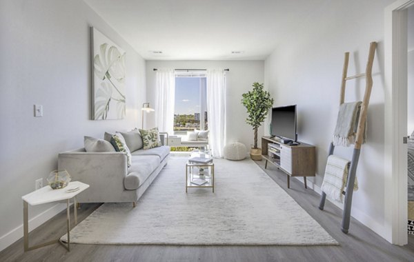 Spacious living room with modern decor at Miscela Apartments