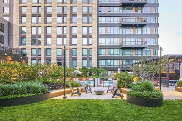 Cozy fire pit on a stylish patio at Miscela Apartments