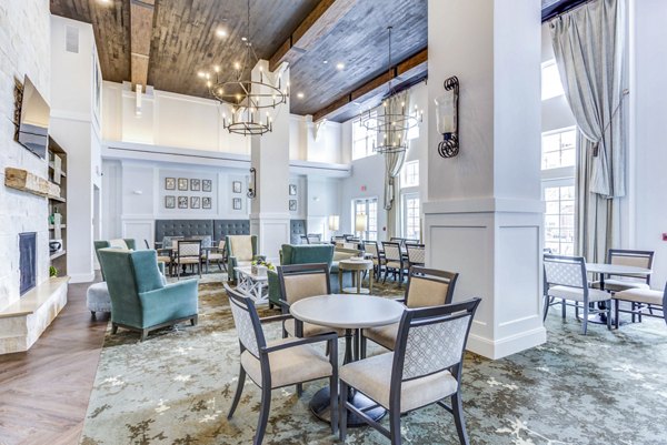 Clubhouse with modern design and cozy seating at Everleigh Naperville Apartments