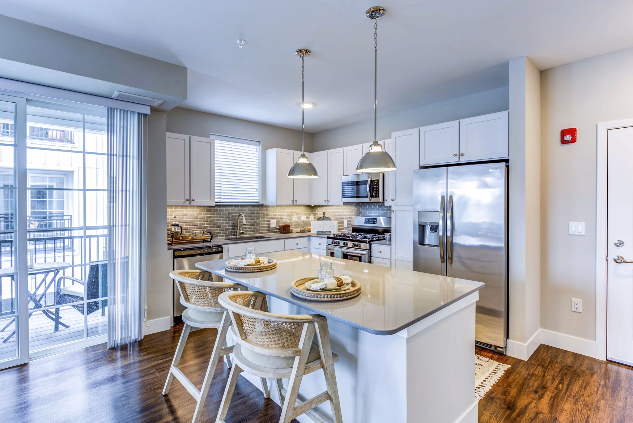 Contemporary kitchen with modern appliances at Everleigh Naperville Apartments, luxury property offering stylish living spaces