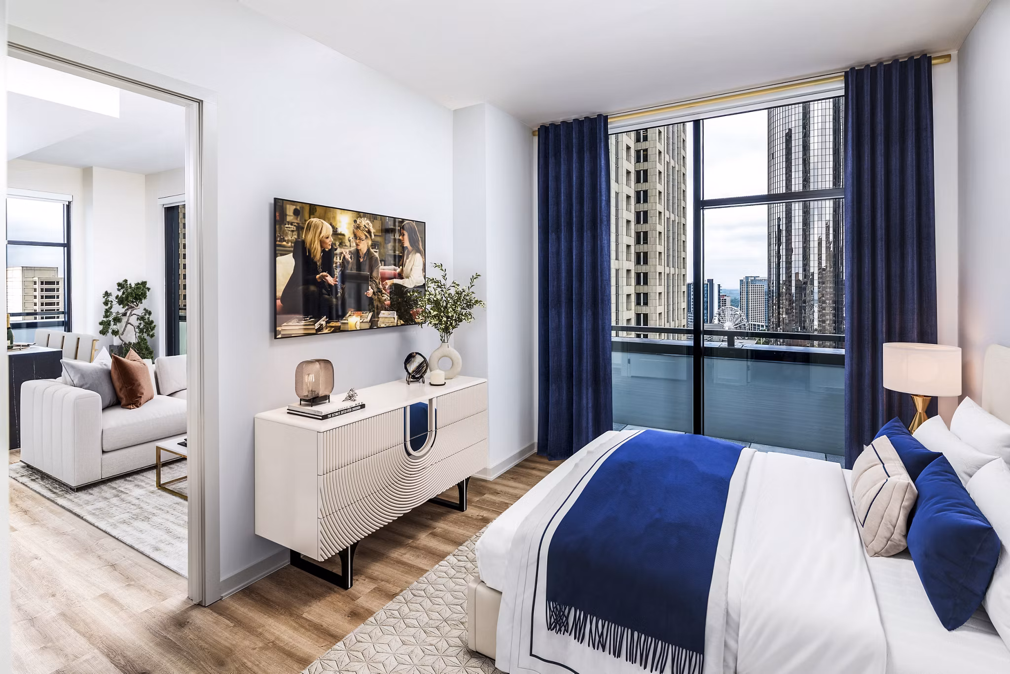 Ascent Peachtree Apartments: Elegant bedroom with city views and modern decor in luxury high-rise